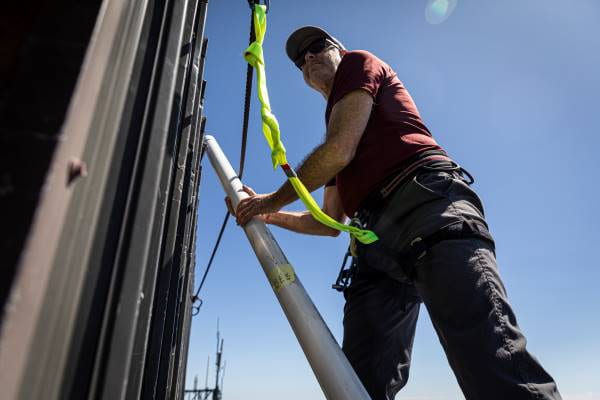 Dan Jaffe installing equipment on top of MBO, July 2019