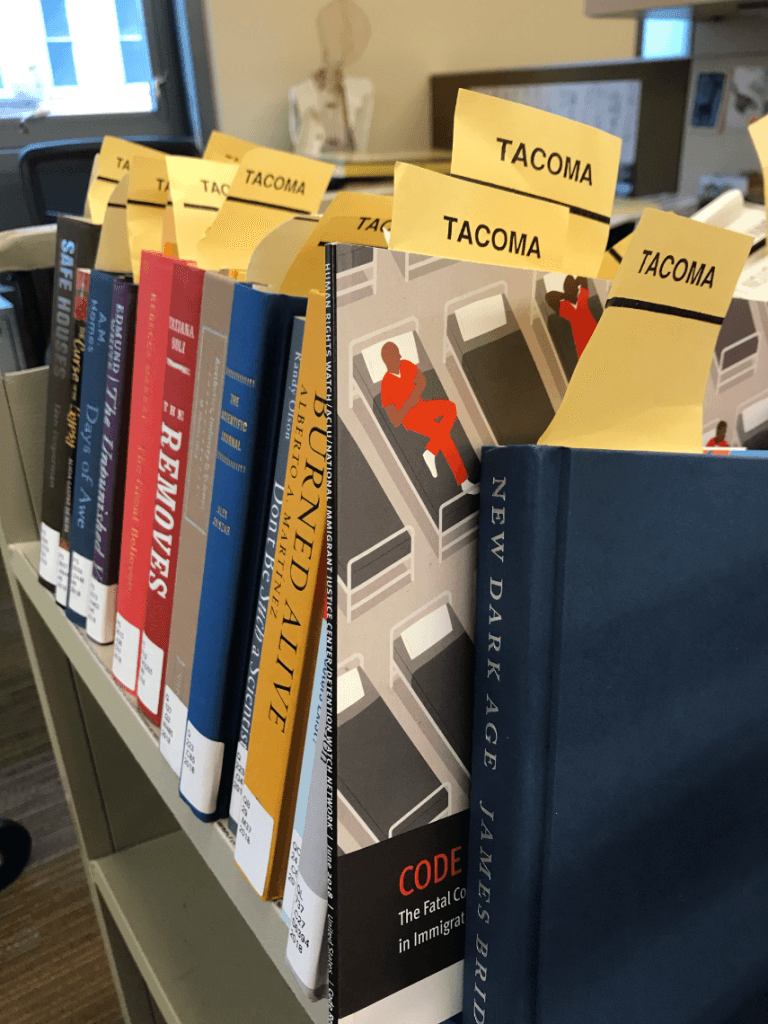 books on a cart ready for library processing