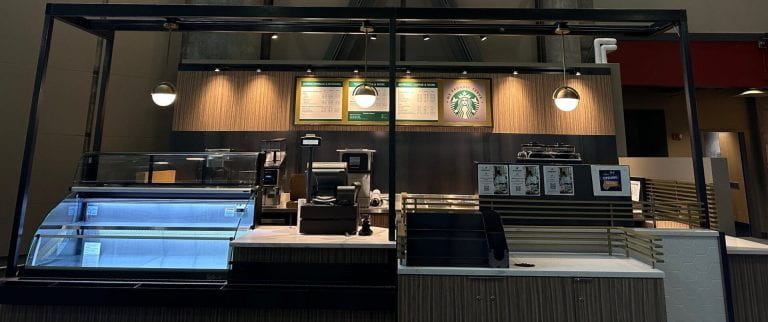 Image of Gold Brew - coffee shop showing counter, menu, and refrigerated case.