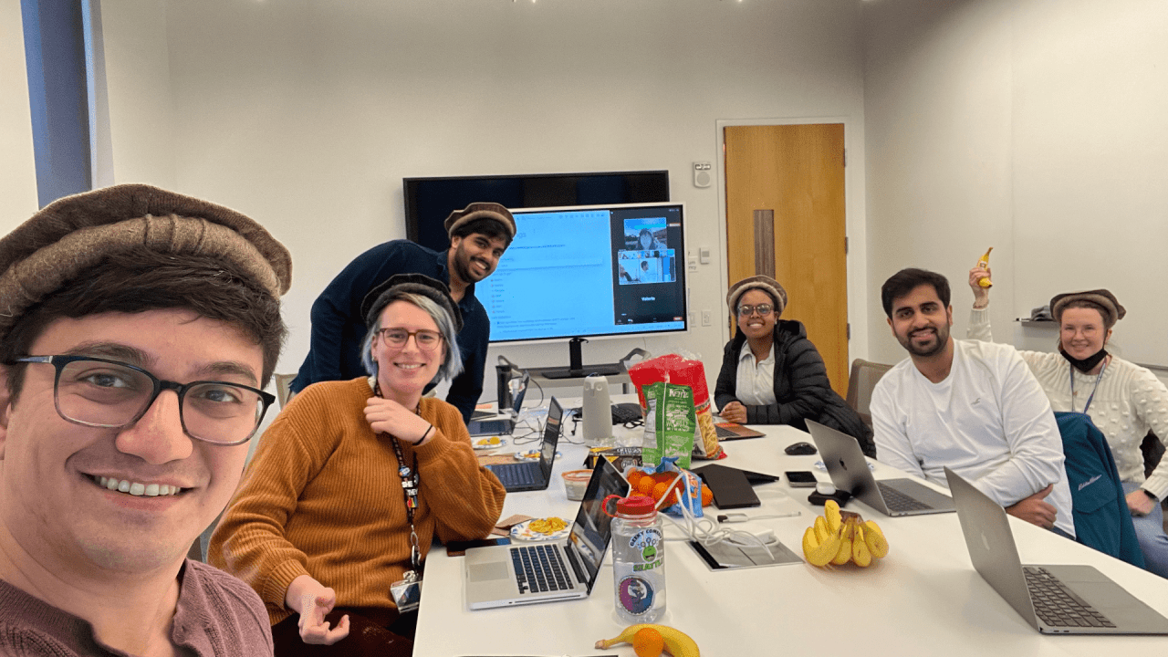 The MatsuLab members wear a traditional Pakistani hat during group meeting.