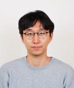 A headshot of a male Korean PhD alumnus in front of a plain background.