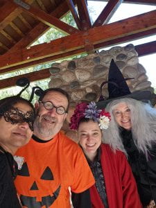 Four Wellness Team Members in Halloween Costumes