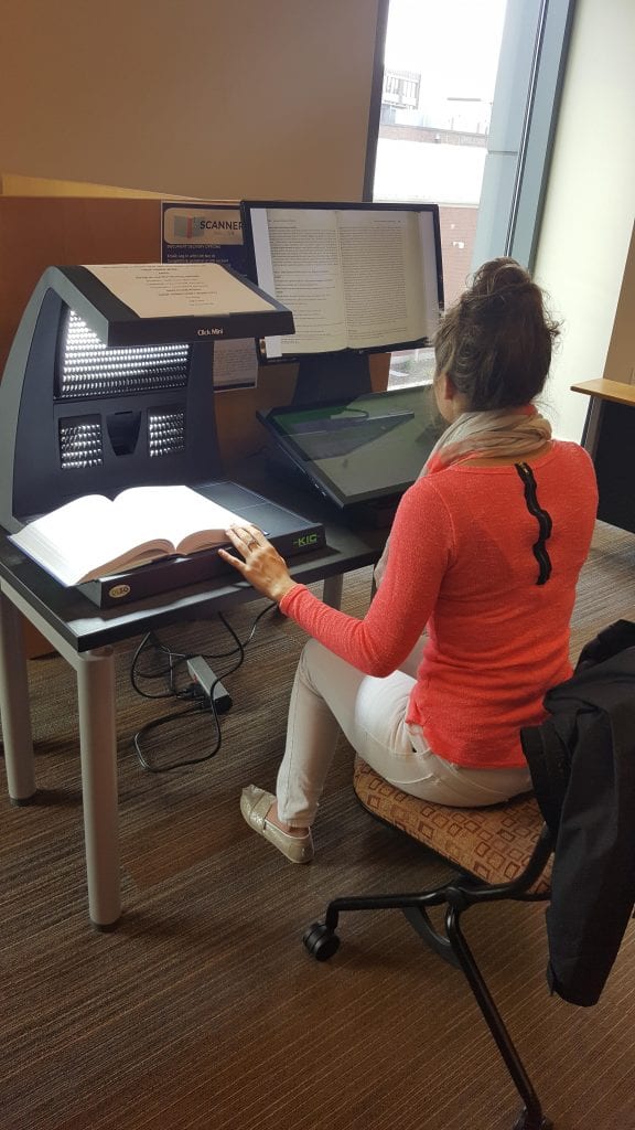 Student using an overhead scanner