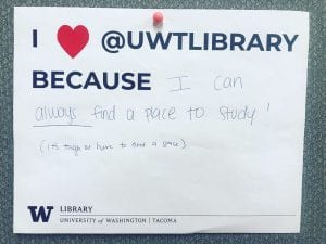 Sign with text about why patrons like UW Tacoma library ("I can always find a place to study!")
