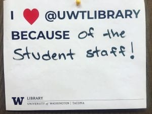 Sign about why patrons love UW Tacoma Library ("because of the student staff!")
