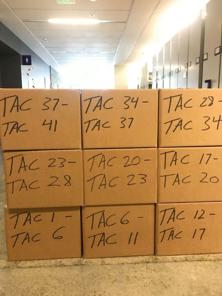 9 stacked boxes (3-high) handmarked in black TAC 1 - TAC 6, etc. through TAC 37 - TAC 41