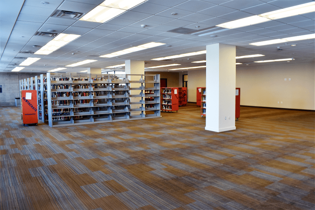Photo of Tioga Library Building second floor almost completely cleared of books and shelving to make way for construction crews