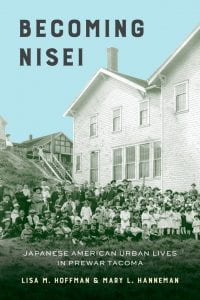 Cover of Becoming Nisei, which shows a black and white photo of a group of people sitting on grass in front of a large white building, with the title imposed on a blue sky