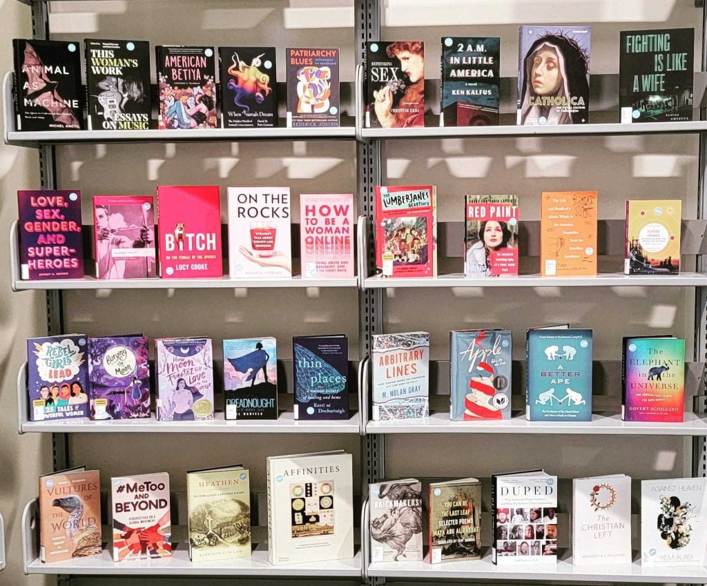 Shelves of new books organized by cover color