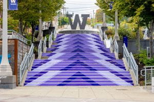 A decorative photo of purple chevrons shapes on the treads of the UWT campus staircase.