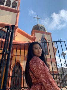 Adrianna outside of Iglesia Juan XXIII Nuestra, a local church in the neighborhood of Tarija