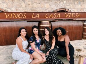 Adrianna posing with three friends at Vinos la Casa Vieja.